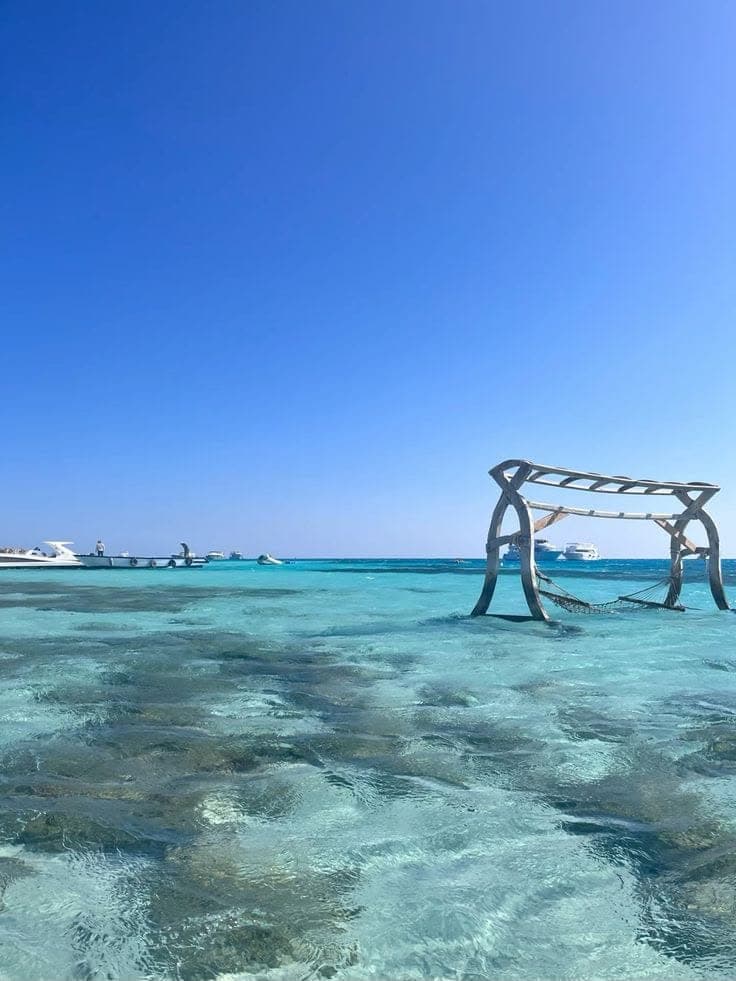 Swing frame standing in clear shallow water off Paradise Island